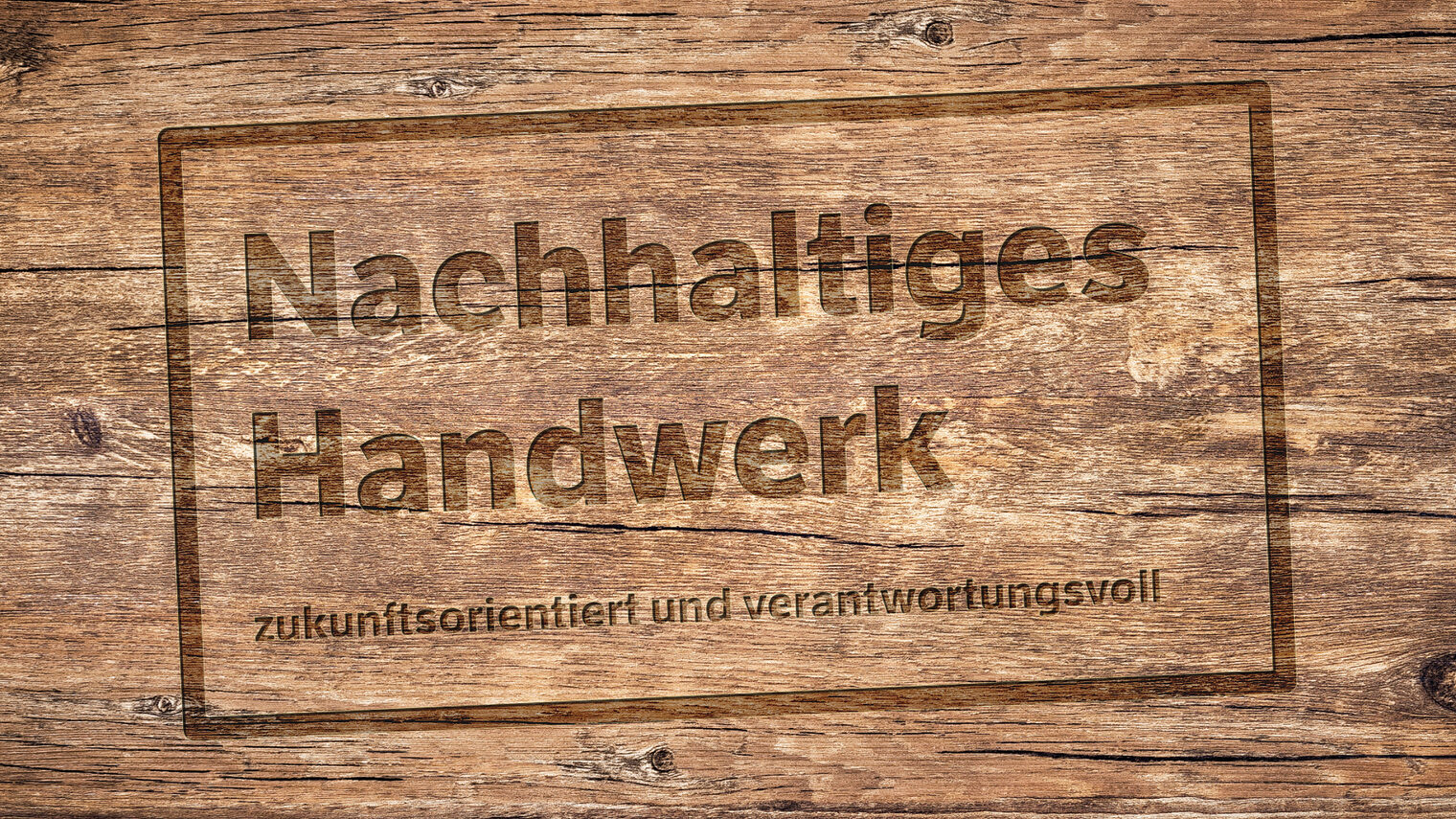 Holzplatte in der visuell vertieft folgendes steht: Nachhaltiges Handwerk - zukunftsorientiert und verantwortungsvoll