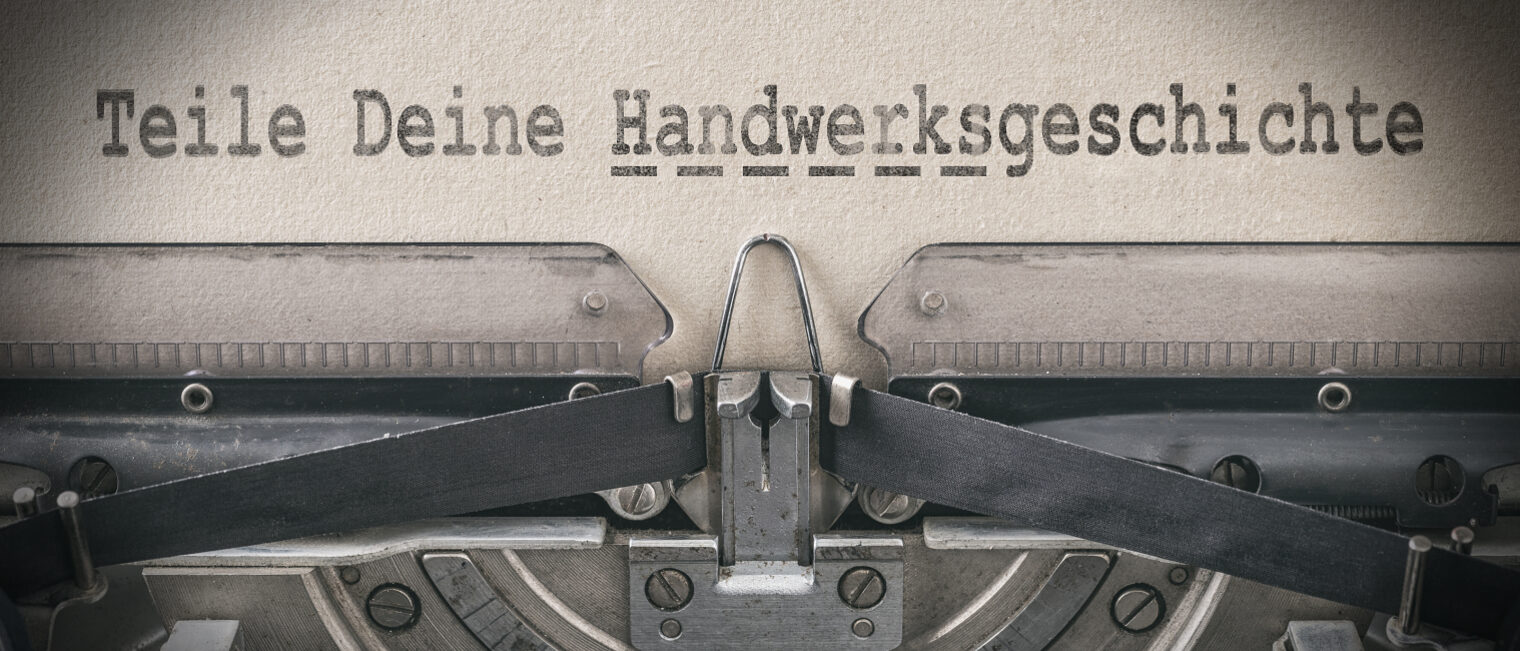 Nahaufnahme Schreibmaschine: Text "Teile Deine Handwerksgeschichte